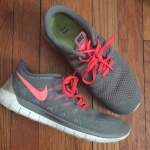 Gray and coral Nike Free 5.0